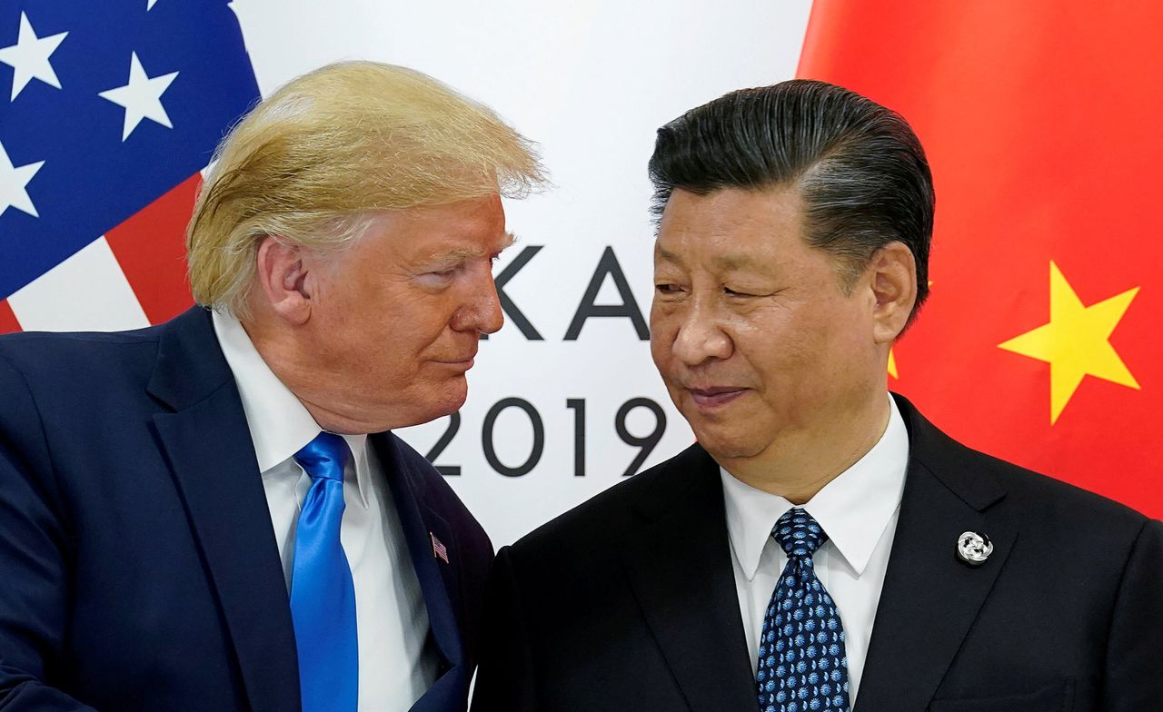 De Amerikaanse president Donald Trump met diens Chinese ambtsgenoot Xi Jinping, vorig jaar op de G20-top in Japan.