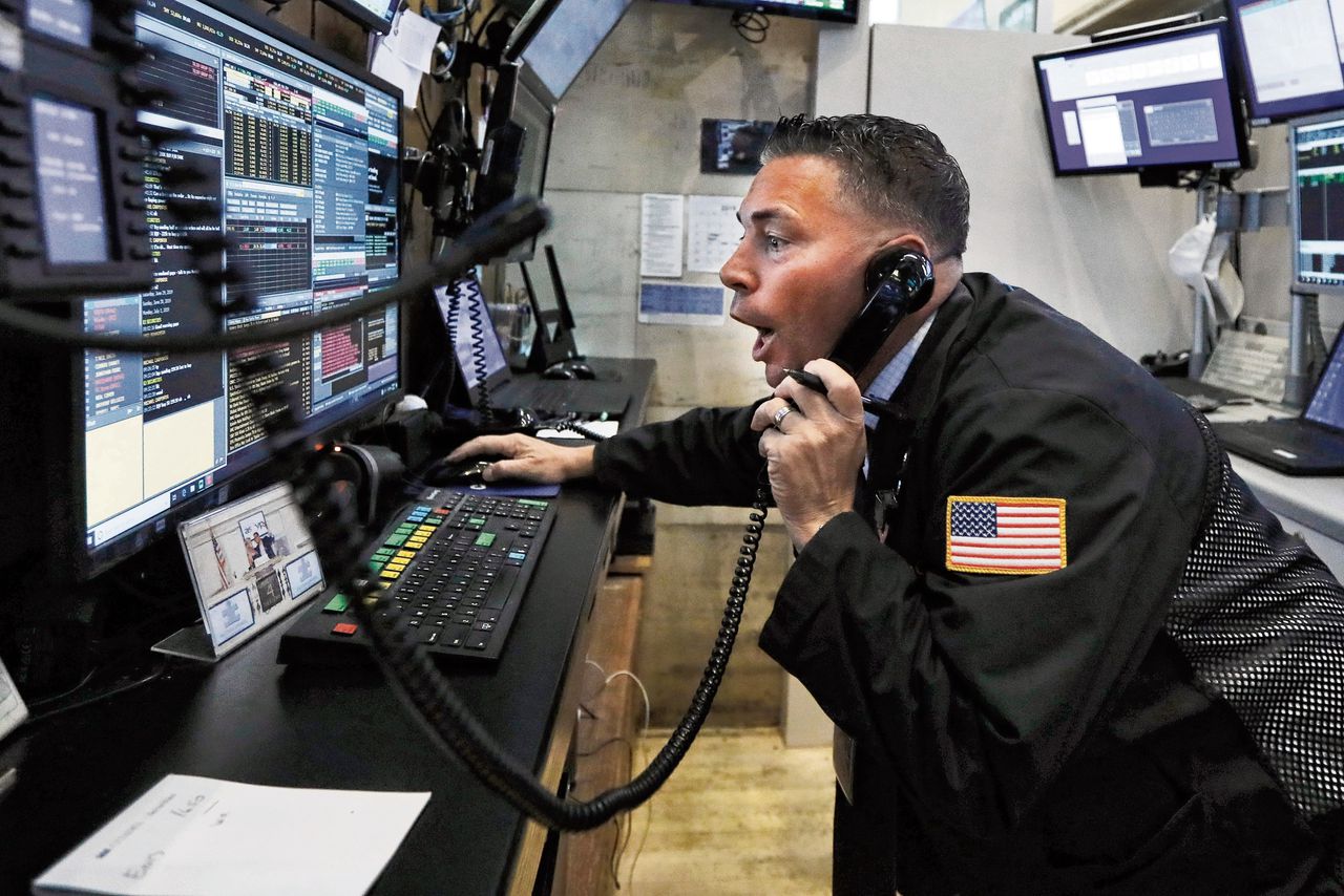 Een beurshandelaar op de New York Stock Exchange. Amerikaanse techbedrijven presteerden dit jaar uitzonderlijk goed.
