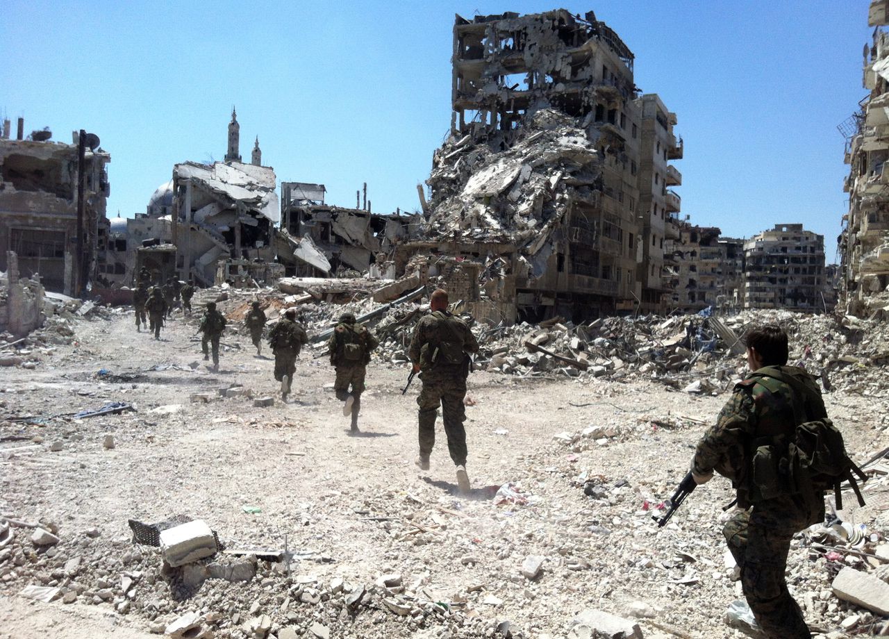 Syrische regeringstroepen in de wijk Khaladiyah in Homs op 28 juli.