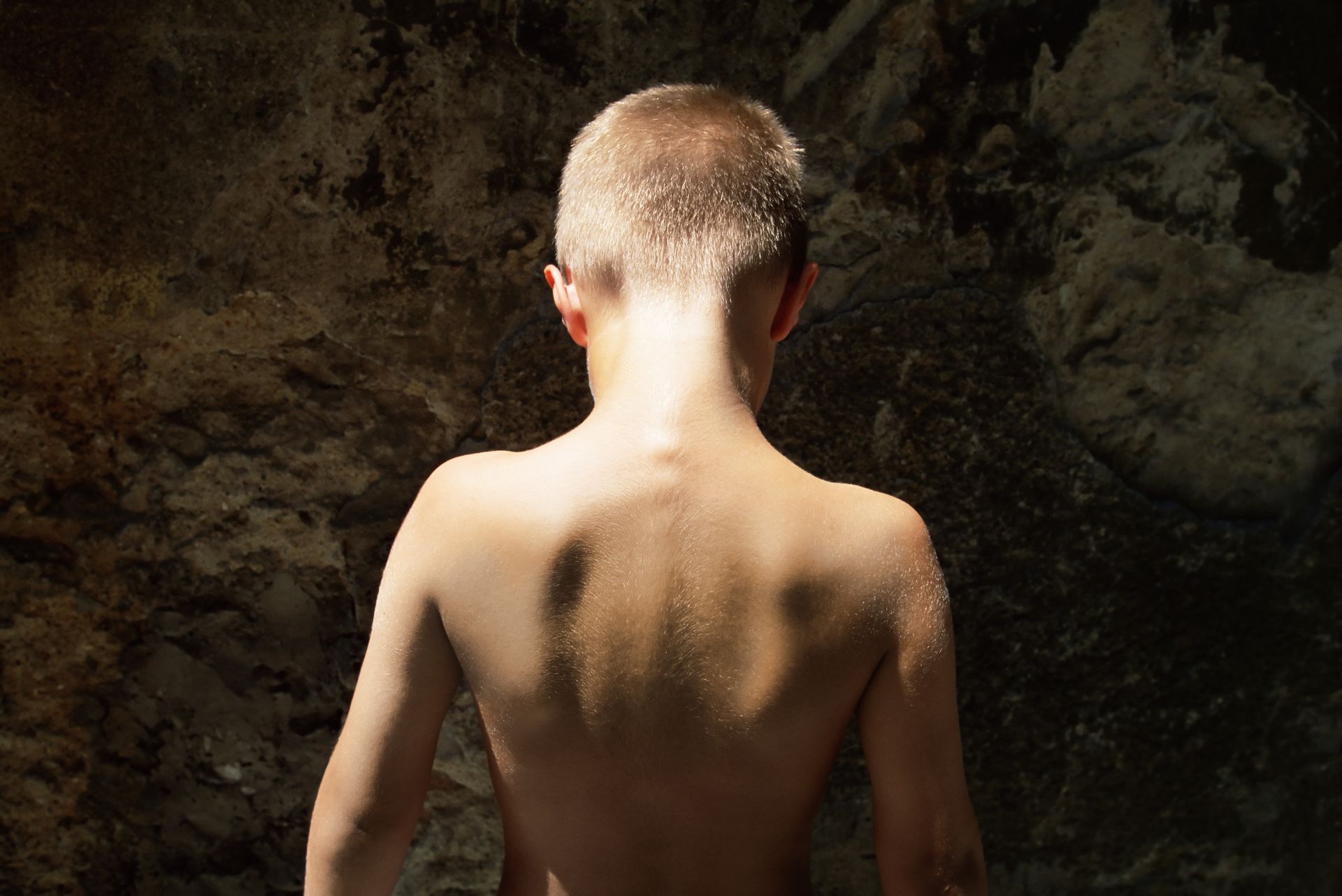 Rear view of boy --- Image by © Image Source/Corbis.