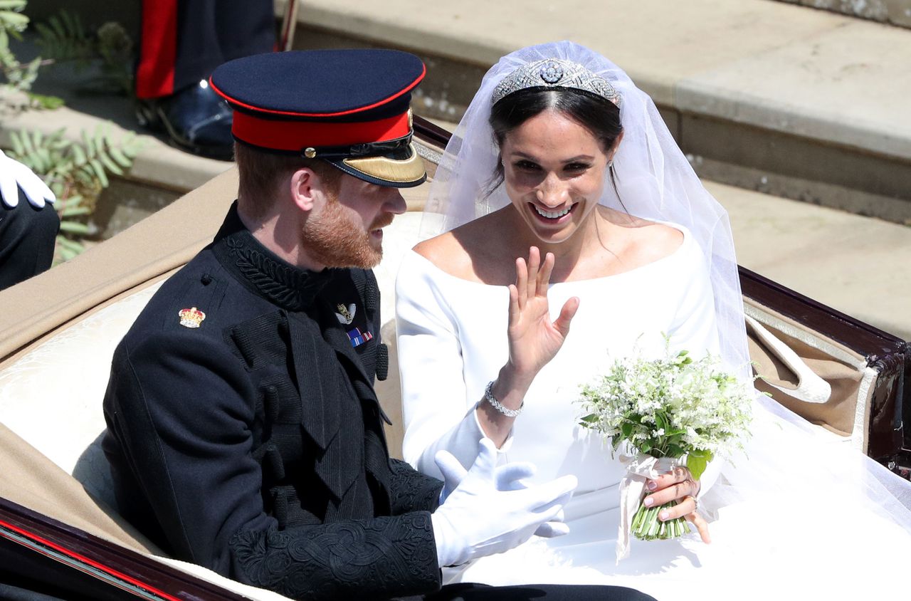 Prins Harry en zijn vrouw Meghan, na de huwelijksceremonie in de kapel van St .George's in Windsor.