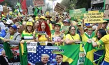 Aanhangers van Bolsonaro gingen afgelopen weekeinde de straat op om steun te betuigen aan de Braziliaanse oud-president. Foto Sebastiao Moreira/EPA  