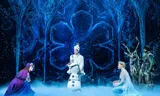 The young Queen Elsa (left), her sister Anna (right) and Snowman Olaf in the musical 'Frozen'. 
