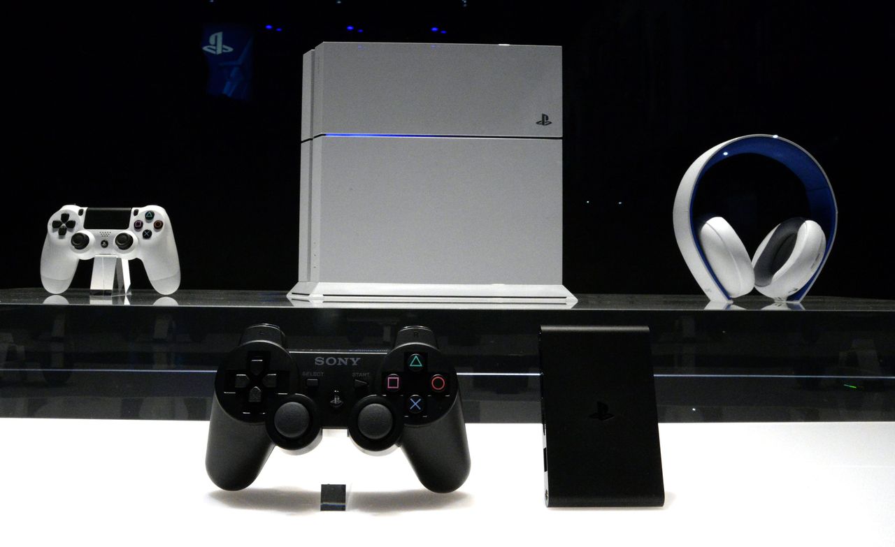 epa04248775 The new white Sony PS4 with headphones and controller (behind) and the Sony PlayStation TV (foreground) is displayed on the opening day of the E3 (Electronic Entertainment Expo) in Los Angeles, California, USA, 10 June 2014. The E3 expo introduces new games and gaming devices and is an anticipated annual event among gaming enthusiasts and marketers. EPA/MICHAEL NELSON