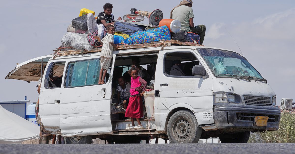 Members of the Haj Ali Araj family, who displaced from Mokha, arrive at Al-Firdaws camp in Ras Imran, on the western