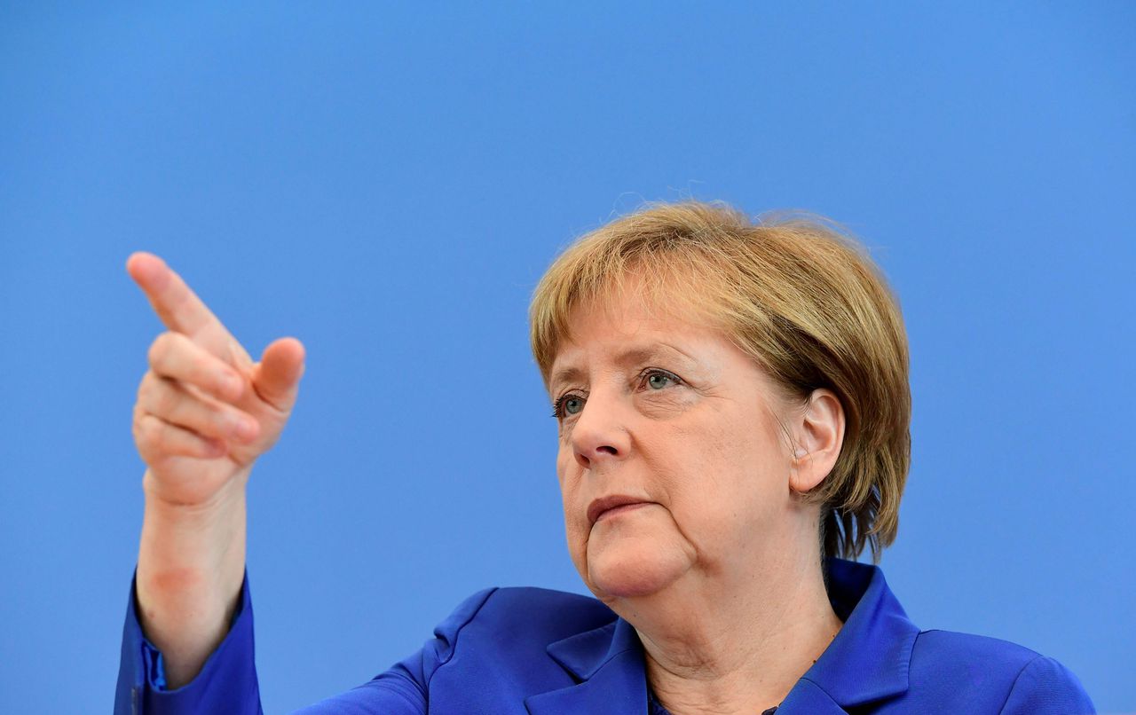 De Duitse bondskanselier Angela Merkel donderdag tijdens de persconferentie waarin ze reageerde op de aanslagen in Duitsland afgelopen week.