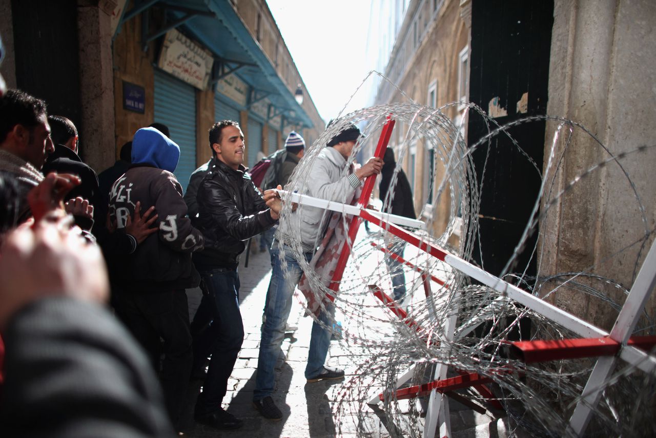 Demonstranten in de Tunesische hoofdstad Tunis tijdens de revolutie van 2011, waarbij dictator Ben Ali ten val kwam.