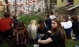 Appartement hit by Russian rocket in Kyiv, where young people wait on Thursday, while rescue workers are looking for a 17-year-old friend and his parents. Photo Valentyn Ogirenko/Reuters