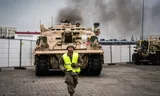 American military vehicles of the 3rd Armored Brigade Combat team come from the ship De Patriot ashore in the Eemshaven. 