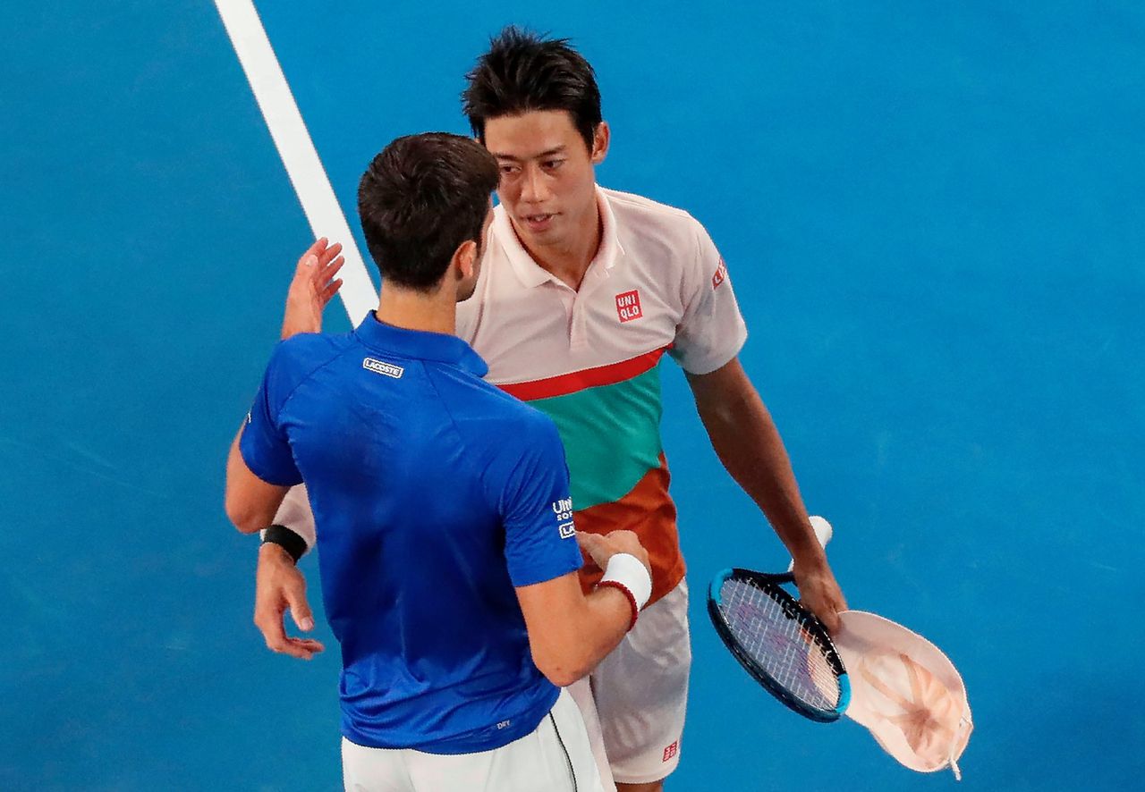 Nishikori en Djokovic na de wedstrijd.