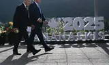 Canadian Prime Minister Mark Carney and U.S. President Donald Trump arrive for a group photo of Group of Seven leaders during the G7 summit in Kananaskis, a resort town in the Canadian Rockies, on June 16.