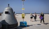 Pole with free sunscreen on IJmuiden beach.