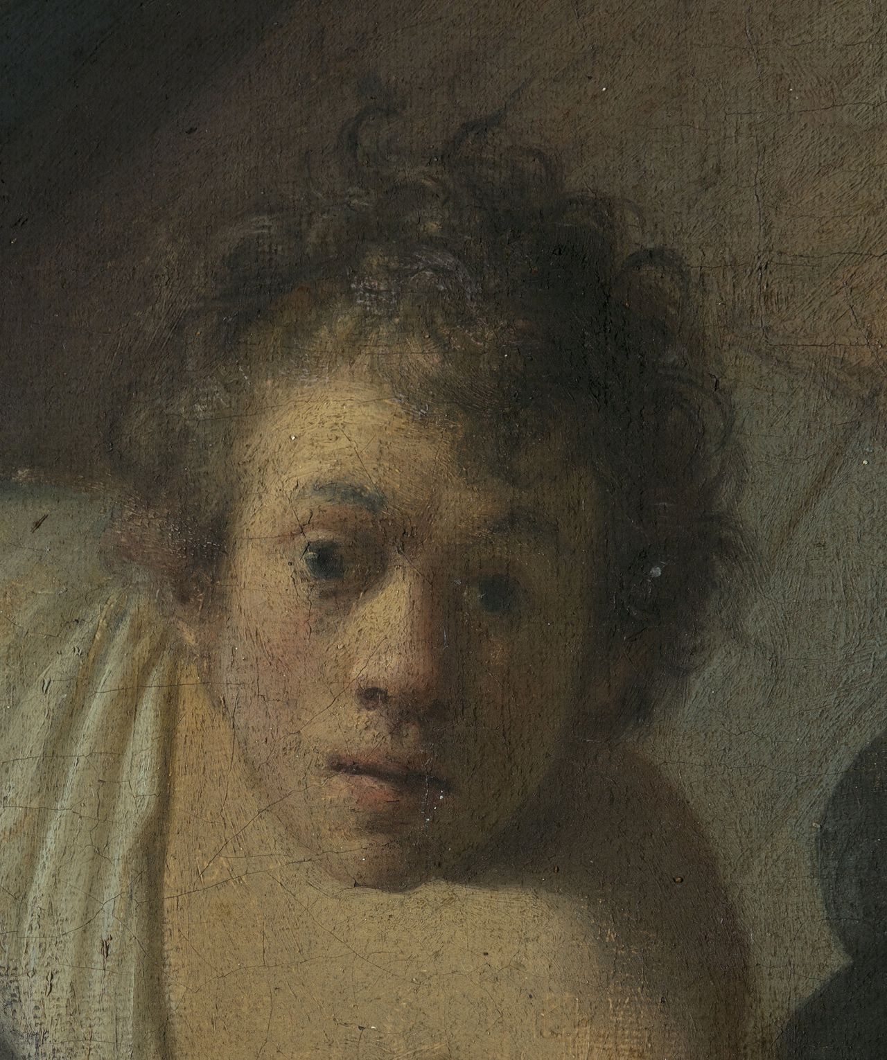 Een uitsnede uit het door Jan Six ontdekte werk van Rembrandt, mede op basis van een mogelijk zelfportret van de schilder.