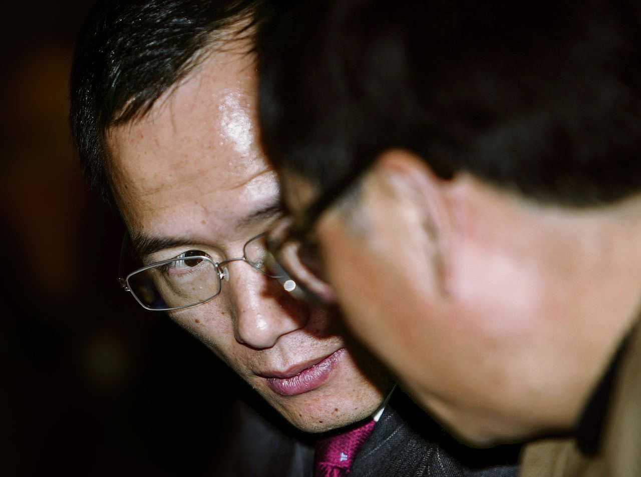 De Chinese zakenman en multimiljardair Guo Guangchang (links).