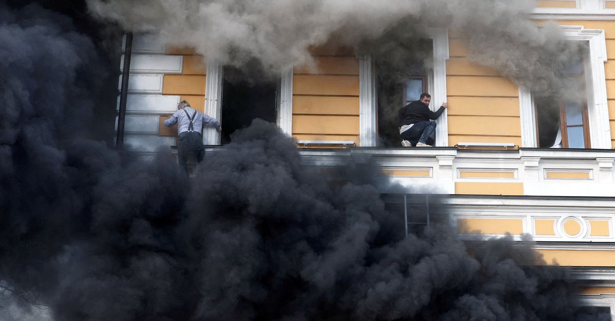 Ihor Malchevsky, 69, a deputy department head at Ukraine’s National Academy of Sciences, tries to evacuate an