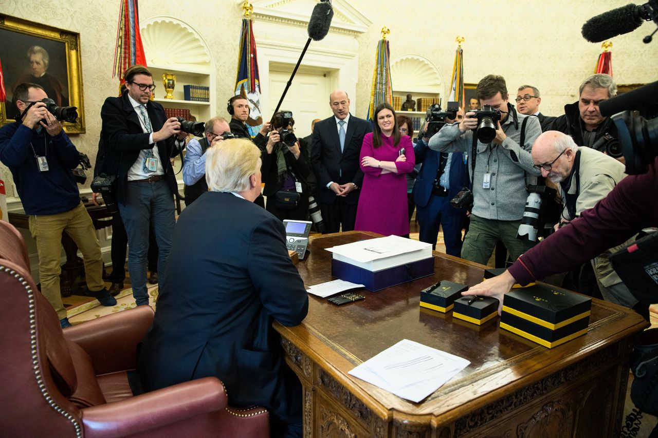 President Trump in december 2017, vlak nadat hij de nieuwe belastingwet ondertekend had.