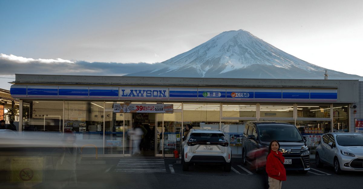 A Japanese town places a barrier on a view of Mount Fuji after disturbing tourists
