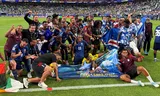 The players and staff of Cape Verde celebrate after the historic qualification for the knockout phase of the World Cup