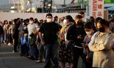 Mensen staan in de rij voor een coronatest in El Salvador. Ook in Midden-Amerikazorgt Omikron voor een razendsnelle toename van besmettingen