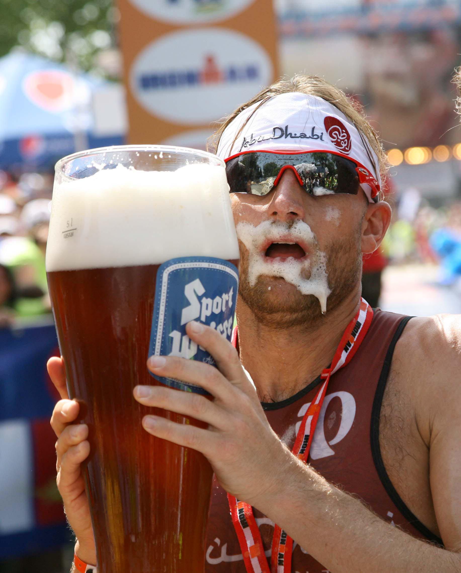 Germany's Faris al Sultan drinks beer after winning the Ironman 2012 C...