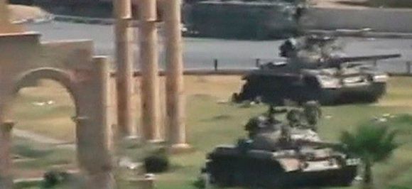 Armoured vehicles are seen stationed in the city of Hama in this still image taken from video posted on a social media website on August 1, 2011. Syrian tanks shelled the city of Hama, scene of a 1982 massacre, for the second day on Monday, killing at least four civilians, residents said, in an assault to try to crush protests against President Bashar al-Assad. REUTERS/Social Media Website via Reuters TV (SYRIA - Tags: CIVIL UNREST POLITICS MILITARY IMAGES OF THE DAY) FOR EDITORIAL USE ONLY. NOT FOR SALE FOR MARKETING OR ADVERTISING CAMPAIGNS. THIS IMAGE HAS BEEN SUPPLIED BY A THIRD PARTY. IT IS DISTRIBUTED, EXACTLY AS RECEIVED BY REUTERS, AS A SERVICE TO CLIENTS