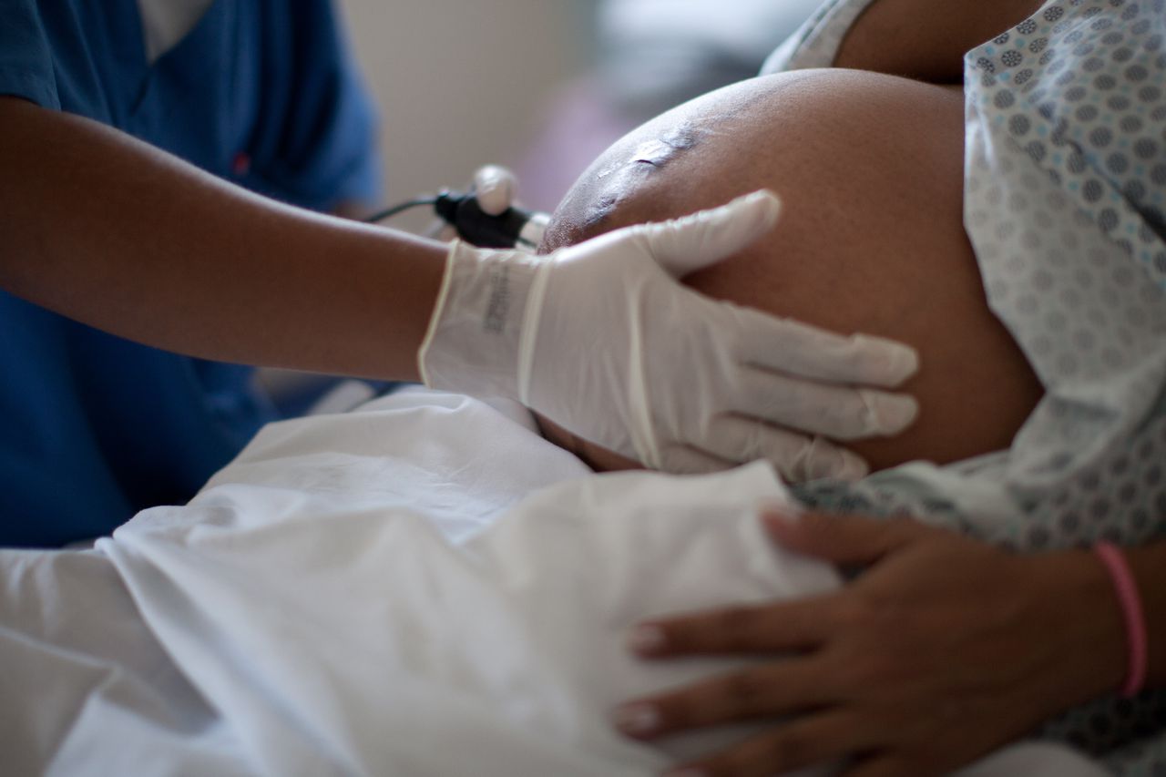 In this Wednesday, July 25, 2012 photo, a pregnant woman is examined as she waits to give birth at a public hospital in Rio de Janeiro. Brazil has one of the world's highest rates of cesarean births - the result of a widely held belief that in this particular field, surgery trumps nature. But some women are beginning to rebel, and the government is on their side with big money to spend on promoting natural birth. (AP Photo/Felipe Dana)