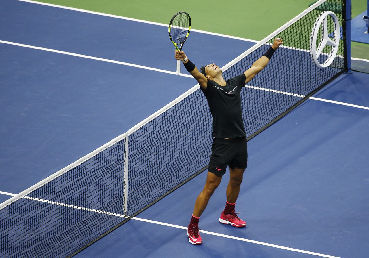 Nadal reageert nadat hij de finale van de US Open gewonnen heeft.