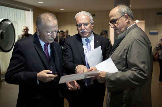Palestinian Foreign Minister Riad al-Maliki, center, talks with Organization of Islamic Conference Secretary General Ekmeleddin Ihsanoglu, left, and historian and Ambassador for Palestine at UNESCO Elias Sanbar, right, during a session of UNESCO's 36th General Conference, in Paris, Monday Oct. 31, 2011. The U.N. cultural agency is weighing a request to admit Palestine as a full member, a highly divisive bid that's part of the Palestinians' broader push for greater international recognition. (AP Photo/Thibault Camus)