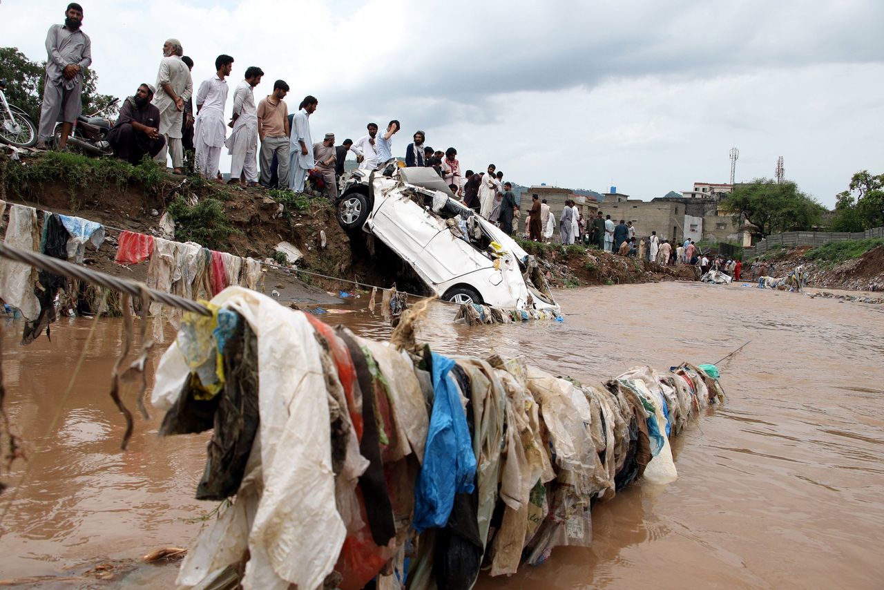 Overstromingen na zware moessonregens in Islamabad, Pakistan. Volgens het IPCC komen weersextremen als droogtes en hoosbuien de komende decennia vaker voor, omdat de aarde verder opwarmt.