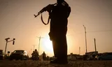 Beveiliging bij een checkpoint in de Afghaanse stad Kandahar op 24 mei. 
