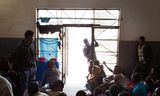 Migranten in een detentiecentrum in Tripoli, Libië, in 2015. Ook Eritreeërs proberen via dit land Europa te bereiken.