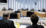 The lawyers Geert-Jan and Carry Knoops in the foreground, in court before the start of the first public session in the case against their client Inez Weski.