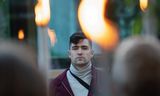 Martin Sellner in 2021 during a torchlight protest in Vienna.