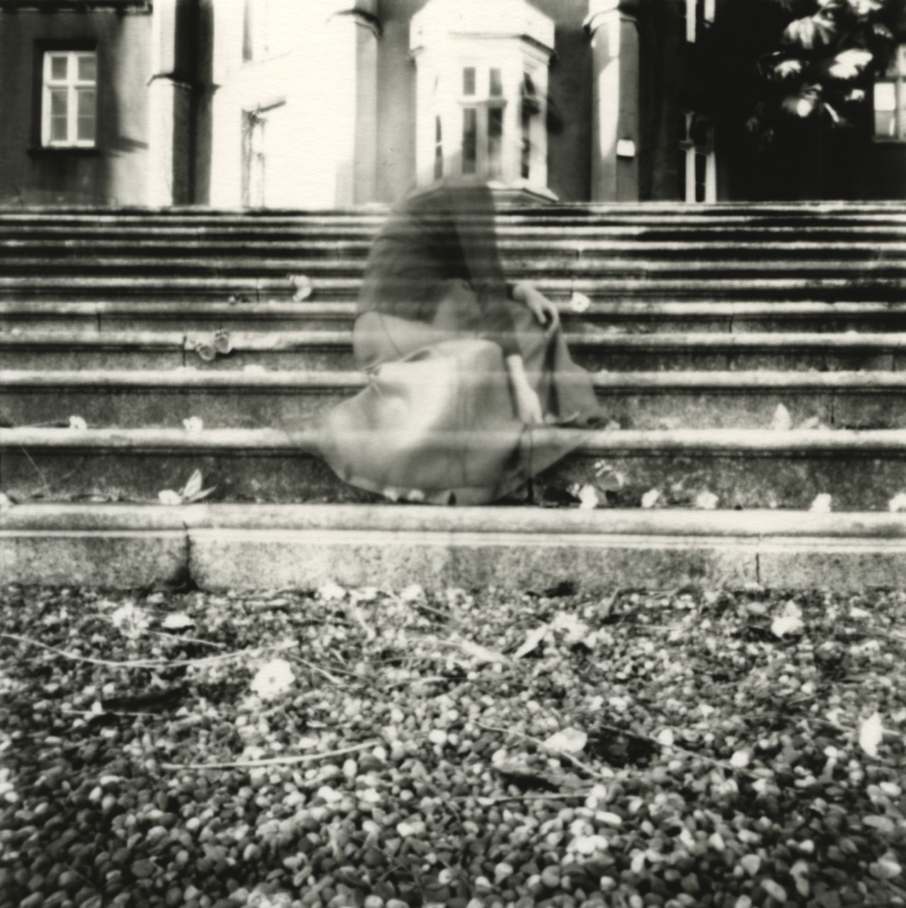 Girl sitting on stone steps