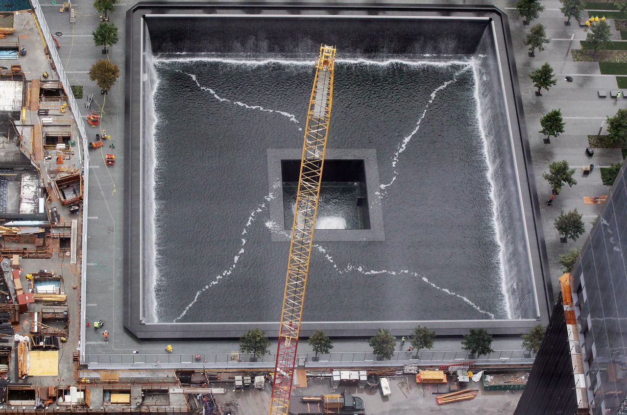 NEW YORK, NY - SEPTEMBER 07: Workers prepare the north pool waterfall as construction continues on the National September 11 Memorial & Museum at the World Trade Center site on September 7, 2011 in New York City. The memorial features two reflecting pools on the footprints of the twin towers. The memorial is scheduled to be dedicated on September 11, 2011, the tenth anniversary of the World Trade Center terrorist attacks. Mario Tama/Getty Images/AFP == FOR NEWSPAPERS, INTERNET, TELCOS & TELEVISION USE ONLY ==