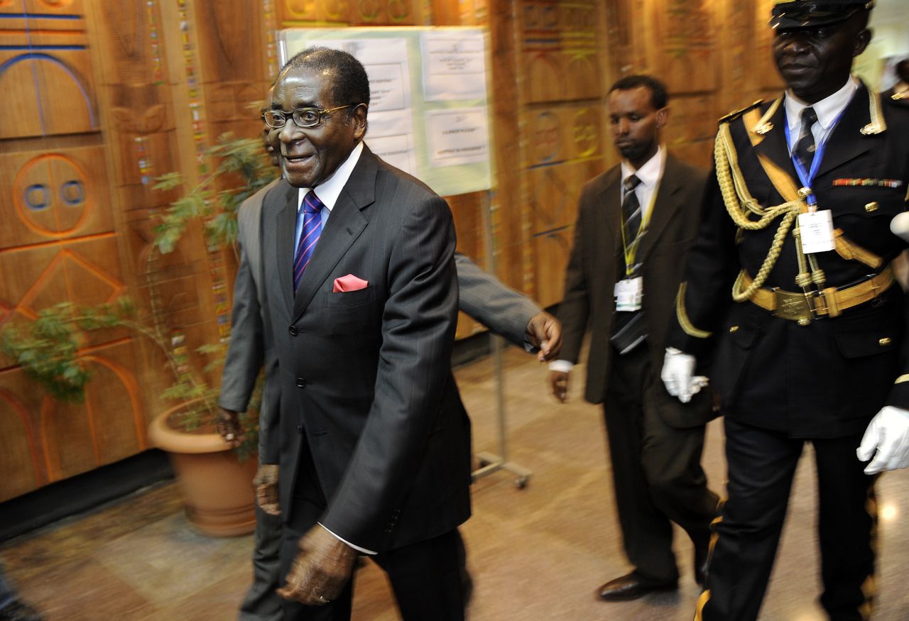 Zimbabwe President, Robert Mugabe (L) arrives January 28, 2011 at the 16th ordinary session of the African Union, AU, in the Ethiopian capital, Addis Ababa. Kenya's Prime Minister, Raila Odinga, the African Union mediator in the Ivory Coast political crisis on Friday called for direct talks between presidential rivals Laurent Gbagbo and Alassane Ouattara. The Kenyan Prime Minister Raila Odinga said an AU summit starting on Sunday should "send a strong and unequivocal message that the two parties must negotiate face-to-face." AFP PHOTO/Tony KARUMBA