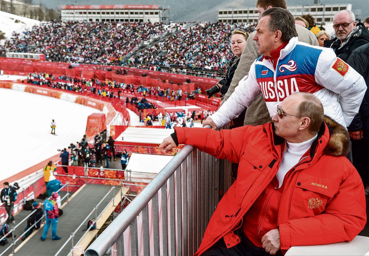 President Vladimir Poetin en de Russische minister van Sport, Vitaly Mutko tijdens de Olympische Spelen in Sotsji.