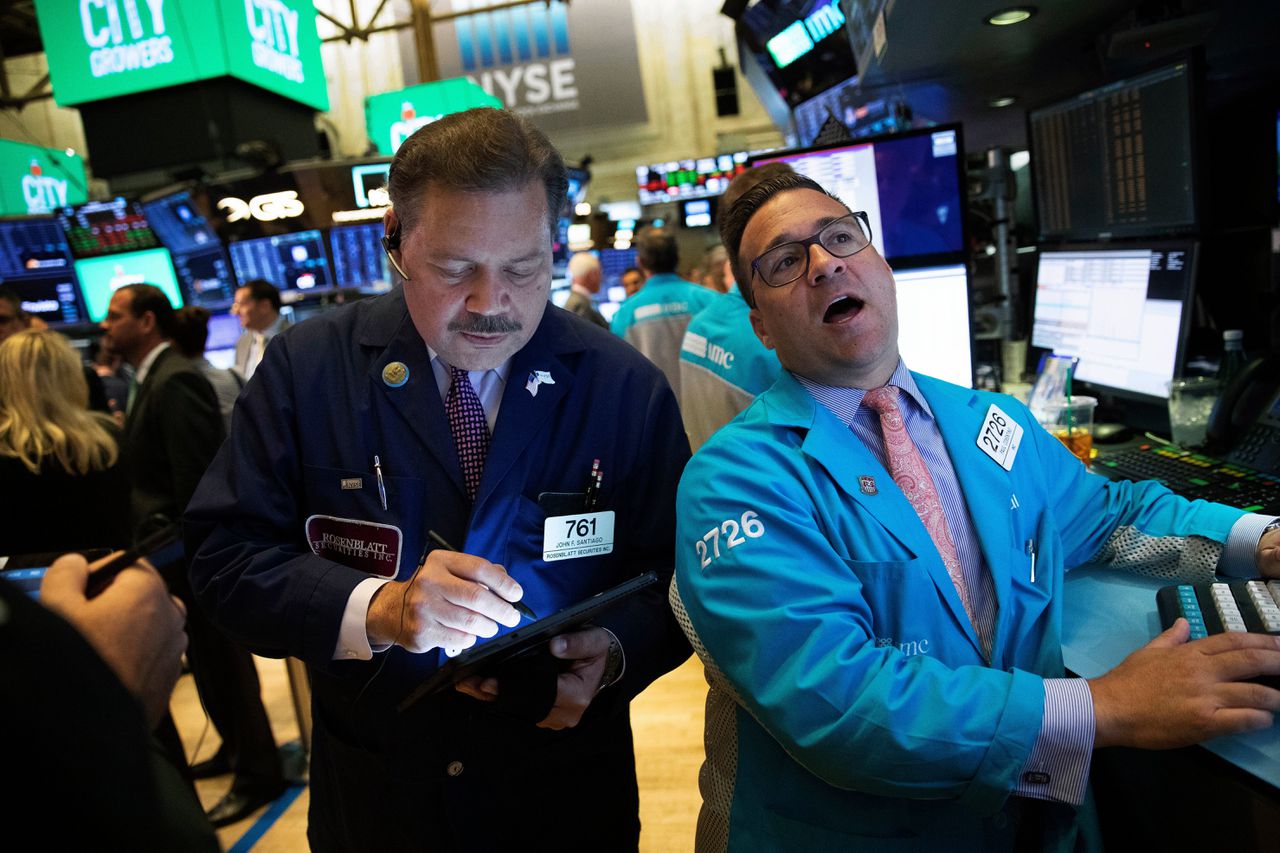 Handelaren donderdag aan de beurs van New York. Beleggers wachtten met spanning op het Fed-rentebesluit.