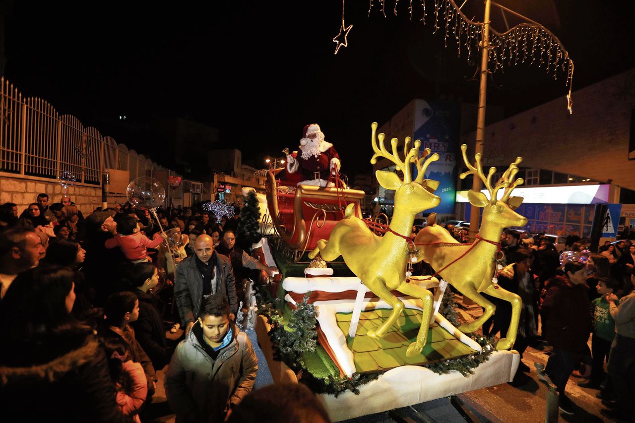 Palestijnse christenen bij een kerstoptocht in Bethlehem, afgelopen donderdag.