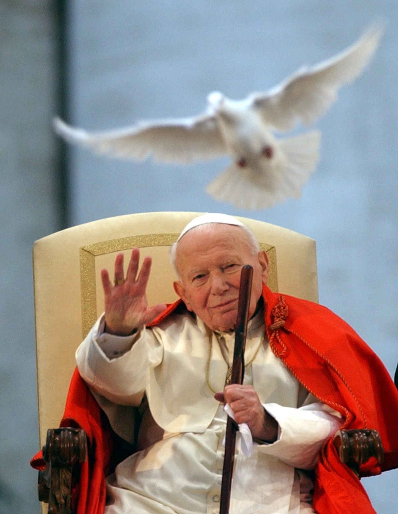 FILE - This April 10, 2003 file photo shows Pope John Paul II as a white dove is released in honor of his repeated calls for peace by Roman youths, in St. Peter's Square at the Vatican. Pope Benedict XVI on Saturday, Dec. 19, 2009, moved Pope John Paul II one step closer to possible beatification, the major milestone before he can be declared a saint. Benedict signed a decree attesting to John Paul's heroic virtues. (AP Photo/Massimo Sambucetti, file)