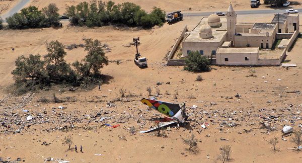 The wreckage of Afriqiyah Airways Flight 771 is seen from an airplane flying over the crash site in Tripoli, Libya Thursday, May 13, 2010. The Dutch boy who was the sole survivor of a plane crash that killed 103 people greeted his relatives with a smile Thursday after they rushed from Holland to his hospital room in Libya and doctors said the 9-year-old was out of danger after successful surgery on his shattered legs.(AP Photo/Andrew Medichini)