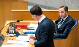 Minister Hugo de Jonge van Volksgezondheid, Welzijn en Sport (CDA) en Premier Mark Rutte bij het Corona debat in de Tweede Kamer.  