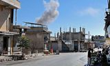 Rook rijst op uit een plaats in de regio Idlib in Syrië, na een luchtbombardement op maandag 6 september.