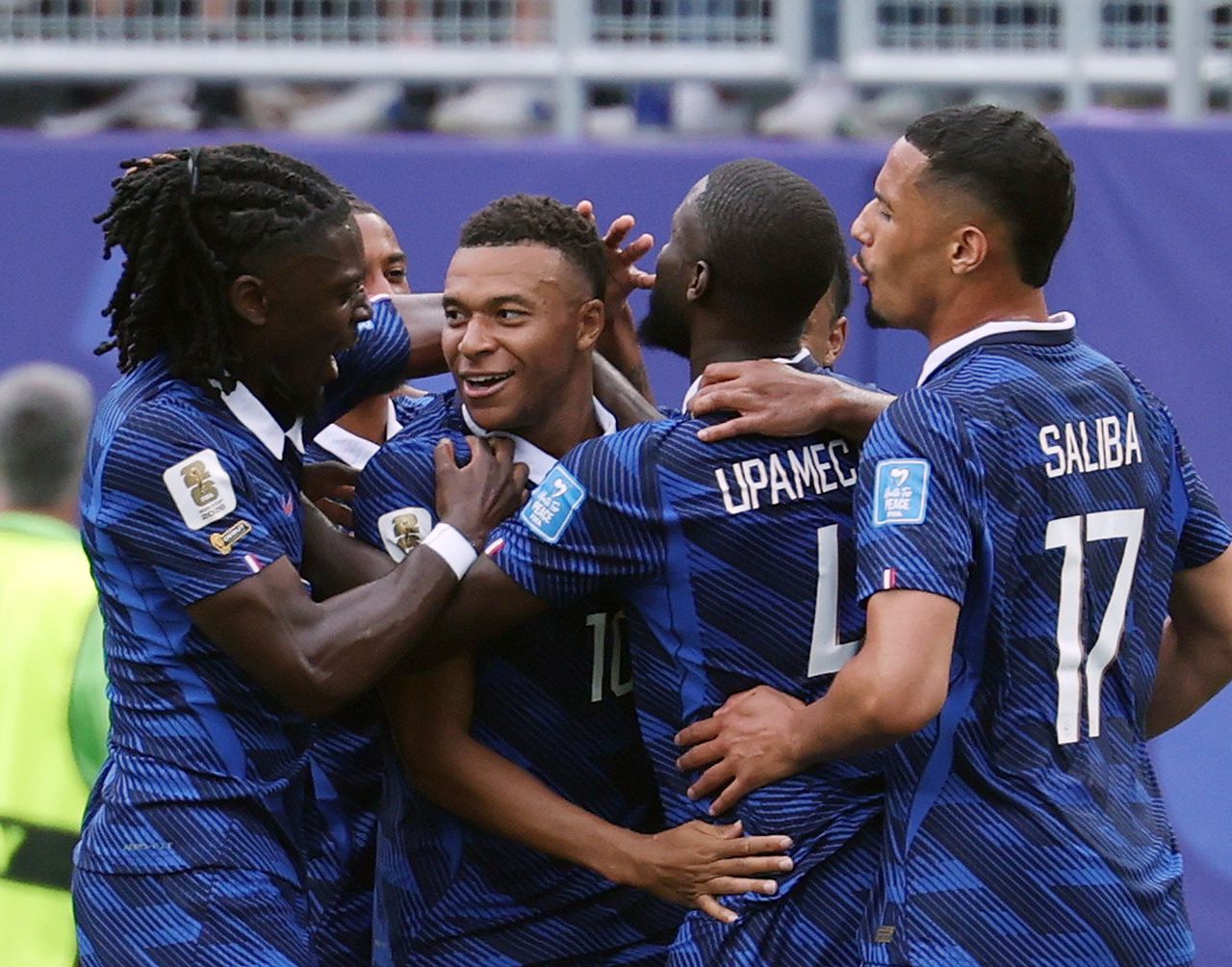 Severe weather halts World Cup match; Mbappé, Messi set records