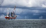 Windmills under construction off the Dutch coast.  Companies active in the energy transition depend on government investments to compete with the fossil sector.