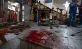 Tijdens de aanslag in de Sint-Elias kerk in Damascus afgelopen zondag kwamen zeker 25 mensen om. Foto Omar Sanadiki/AP  