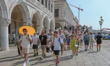 Tourists on the quay at San Marcoplein in Venice. The city council has limited the size of touring groups. 