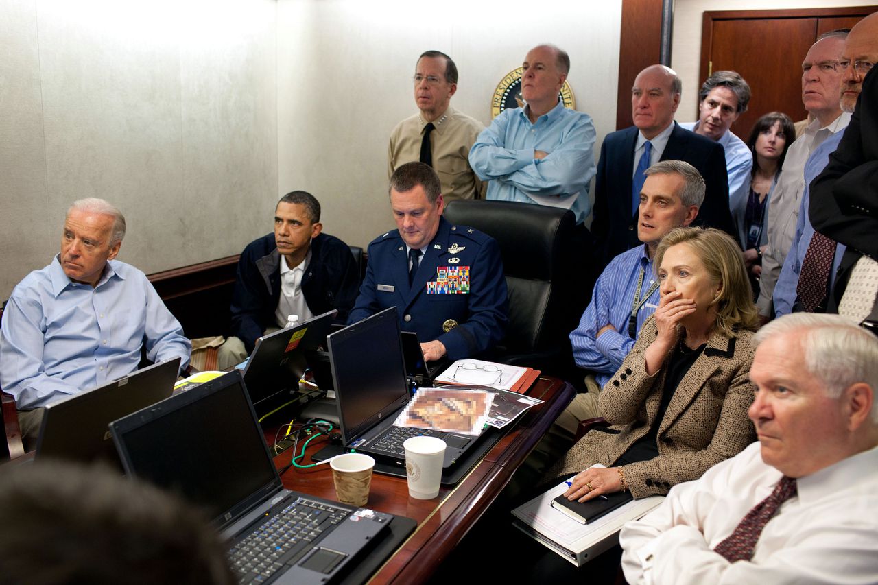 In this image released by the White House and digitally altered by the source to diffuse the paper in front of Secretary of State Hillary Rodham Clinton, President Barack Obama and Vice President Joe Biden, along with with members of the national security team, receive an update on the mission against Osama bin Laden in the Situation Room of the White House, Sunday, May 1, 2011, in Washington. (AP Photo/The White House, Pete Souza)