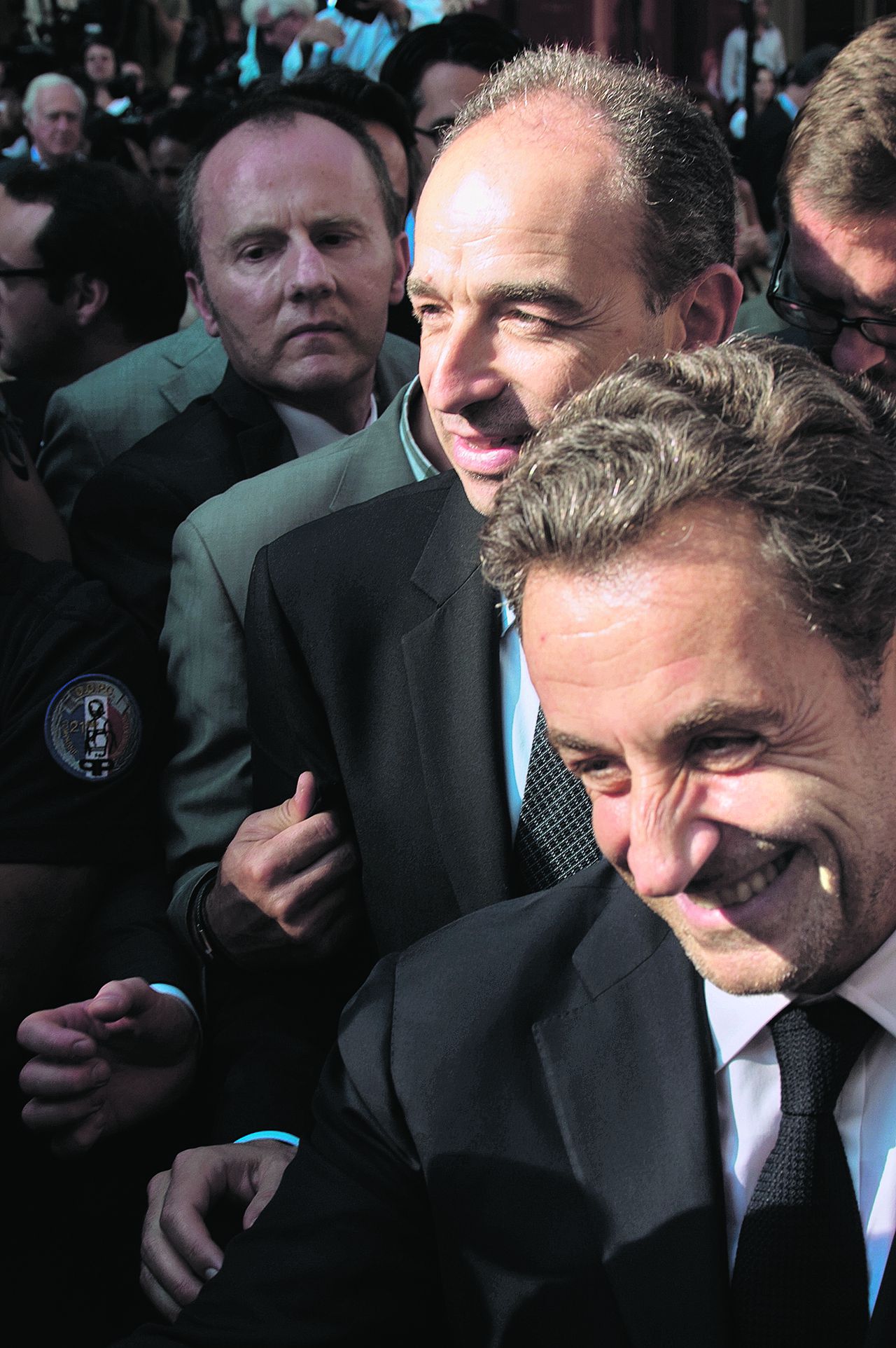 Copé (boven) met Sarkozy op een congres van de UMP in juli 2013.